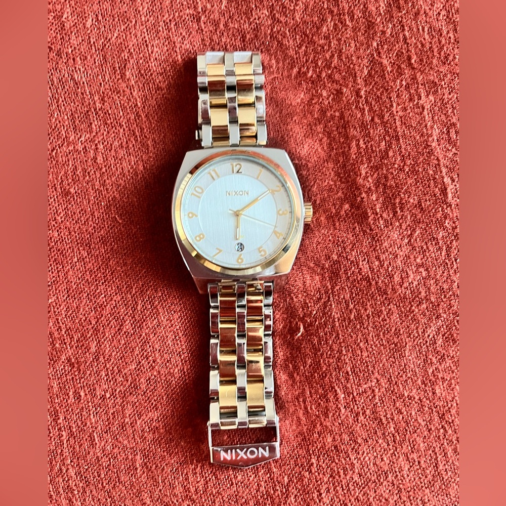Nixon monopoly womens watch. Yellow and gold with white face.